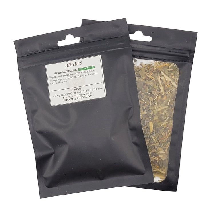 Two black ziplock bags with dried herbs on a white background