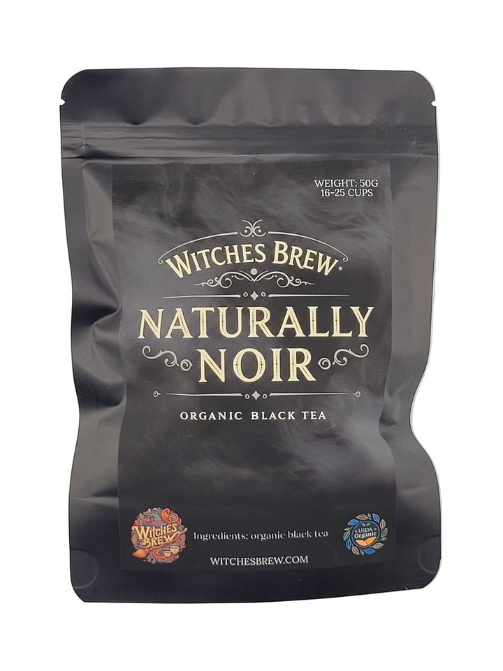 Tea package labeled 'Naturally Noir' by Witches Brew on a white background