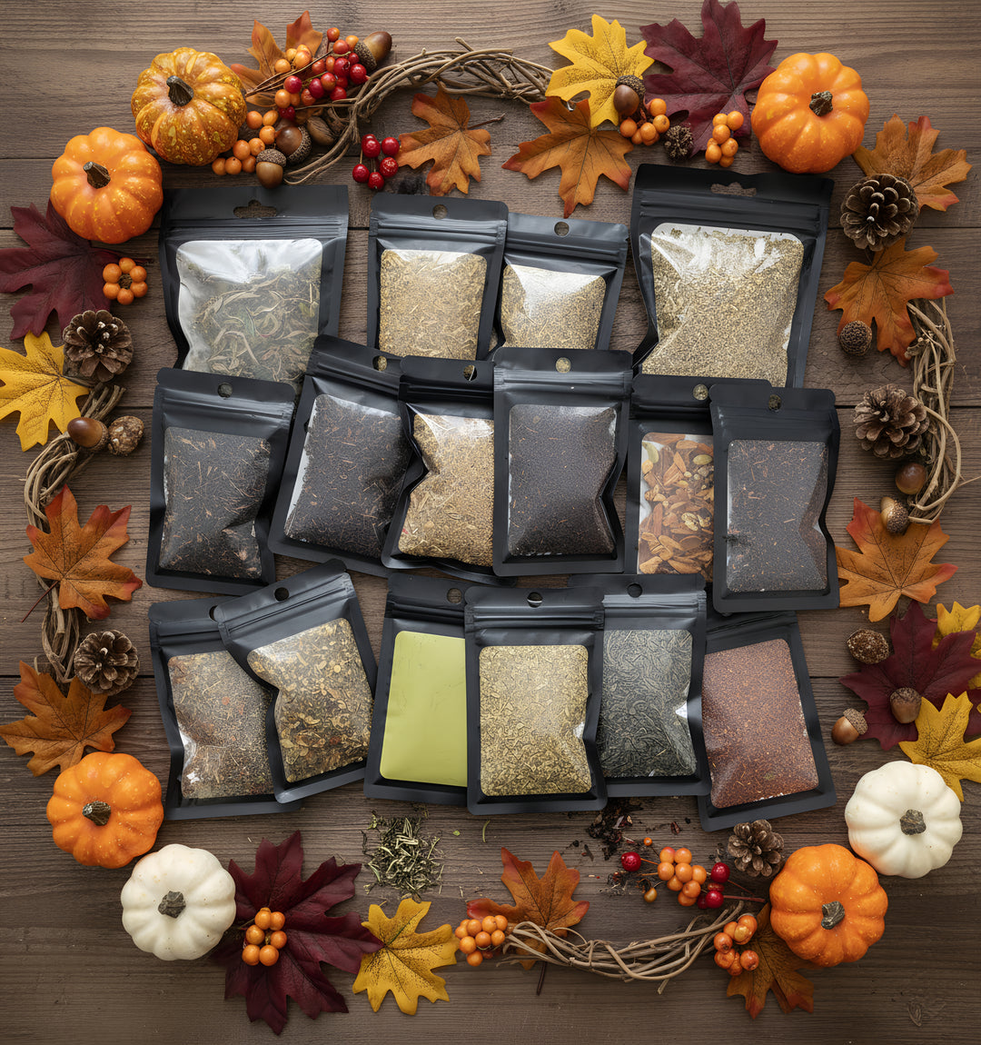 Collection of spice packages on a wooden surface with autumn decorations.