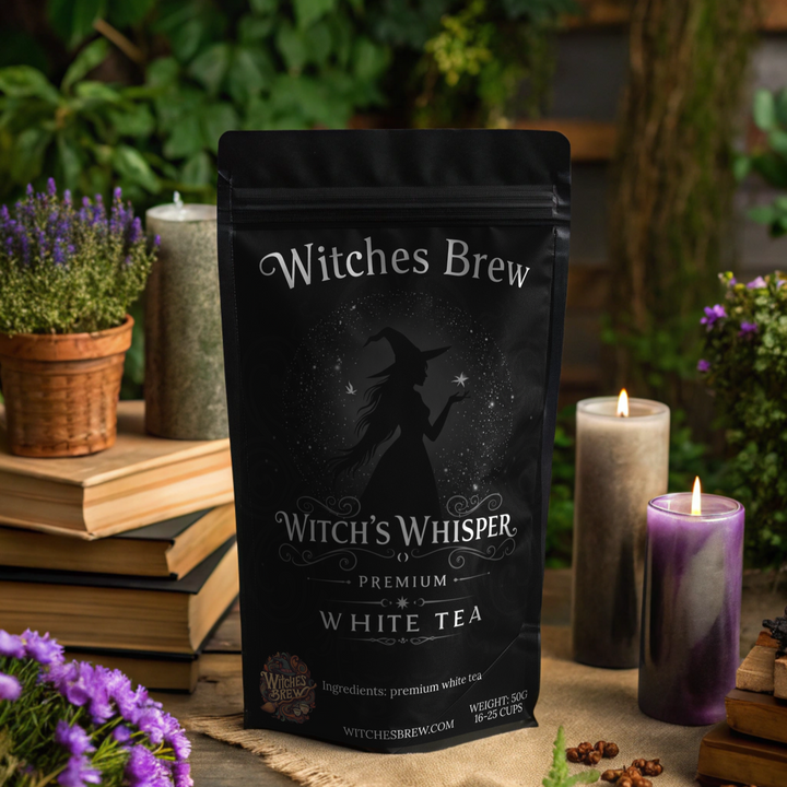 Witches Brew tea package on a table with candles and plants